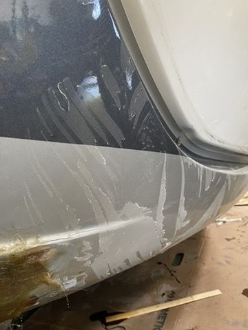 RV front cap before repair, scuffed and damaged